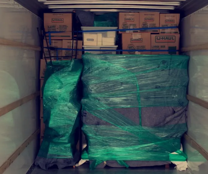 movers loading furniture into storage